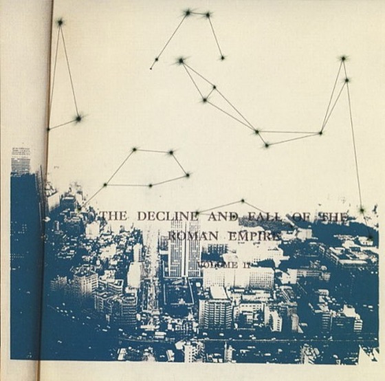 Booklet page: a city skyline under a constellation (UK CD, 2001)