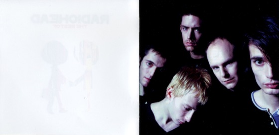 Booklet spread: the figures faded out, and a band portrait (Japanese double, 2008)