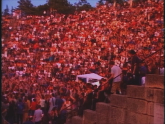 The crowd in the Roman theatre at Vaison-la-Romaine, 28 May 2001, a still from the band's film