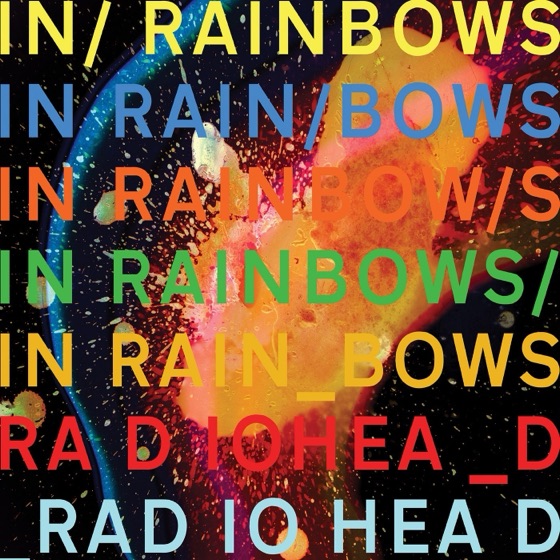 The cover: the title stacked in six colours over Donwood's wax and acid work (2007)