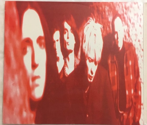 CD2 inner panel: the band photograph in red (Parlophone, UK, 1994)