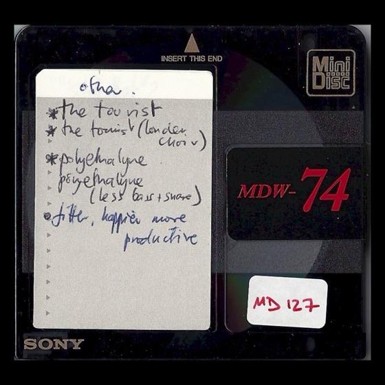 MD127, with “the tourist (london choir)” and “fitter, happier more productive”