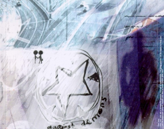 The tray card under the disc, with the star and “against demons” (Parlophone, 1997)
