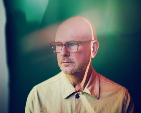 Philip Selway, a portrait in green light issued with the Strange Dance campaign in autumn 2022 and used for the album's singles and release in 2023.