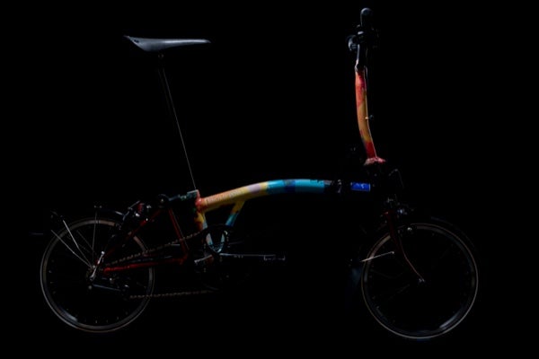 The Radiohead x Crew Nation x Brompton folding bike, shown on black