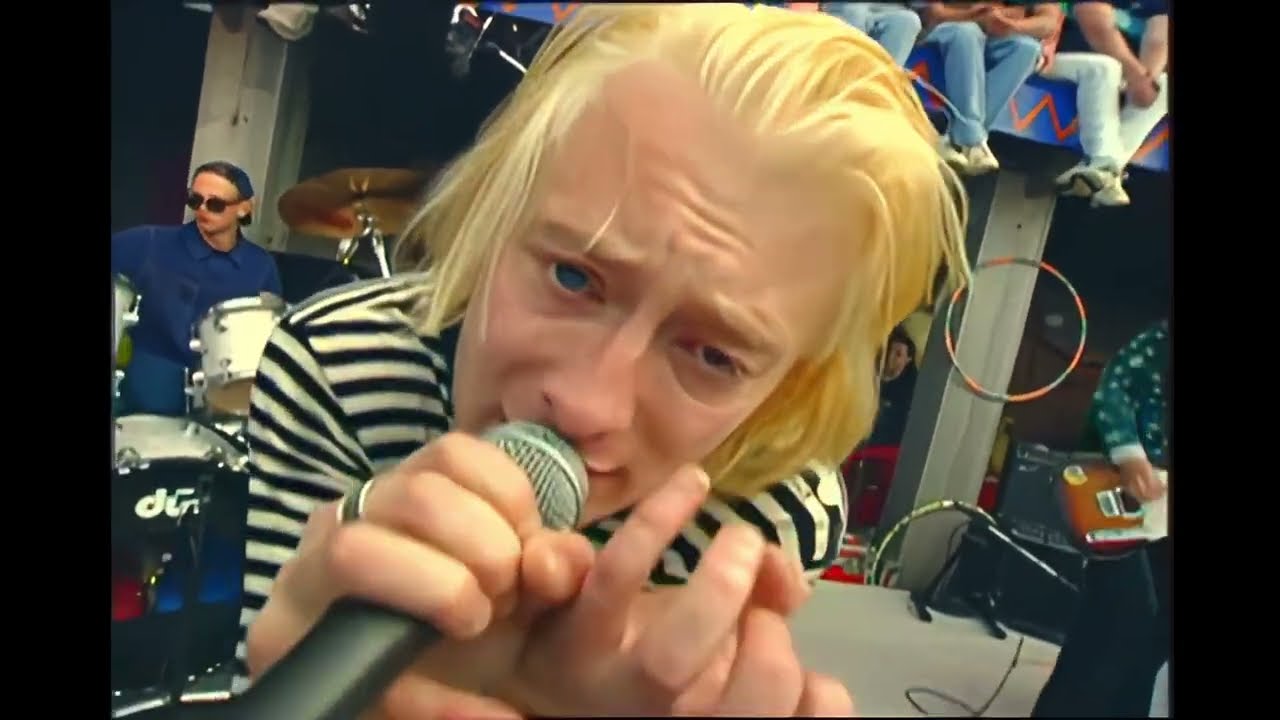 still from the video: “anyone can play guitar”, mtv beach house, 1993